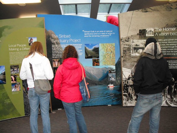 Customers admire new panels at the Milford Discovery Centre as they are installed